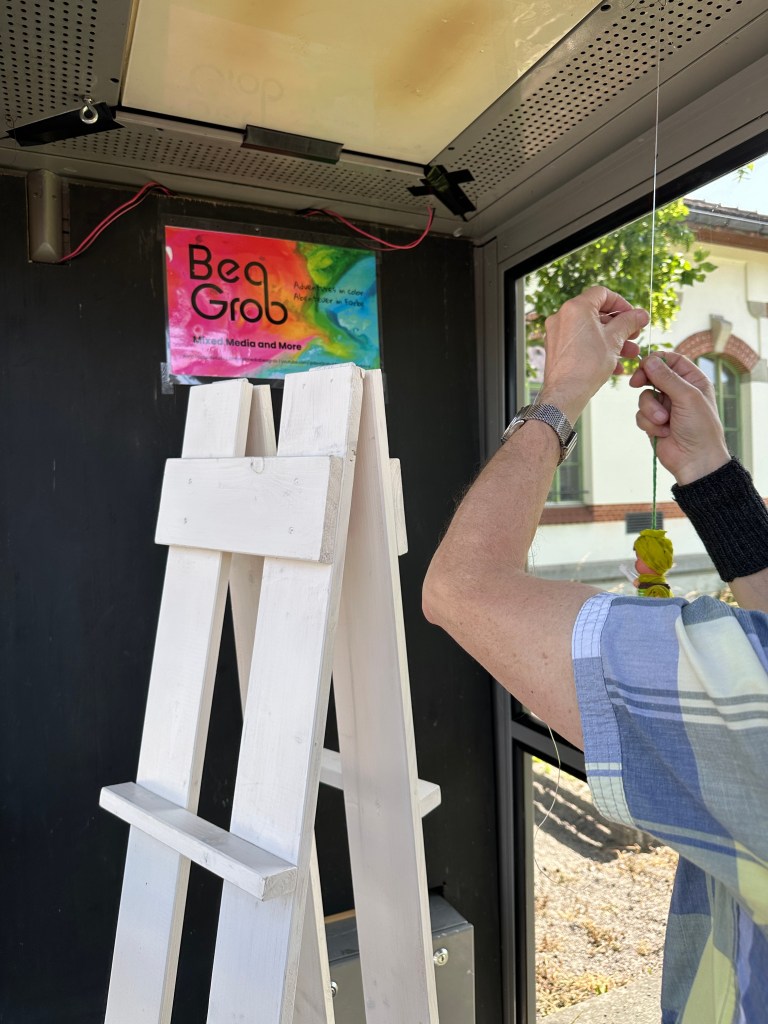 Hanging decorations and arranging the setup inside the booth