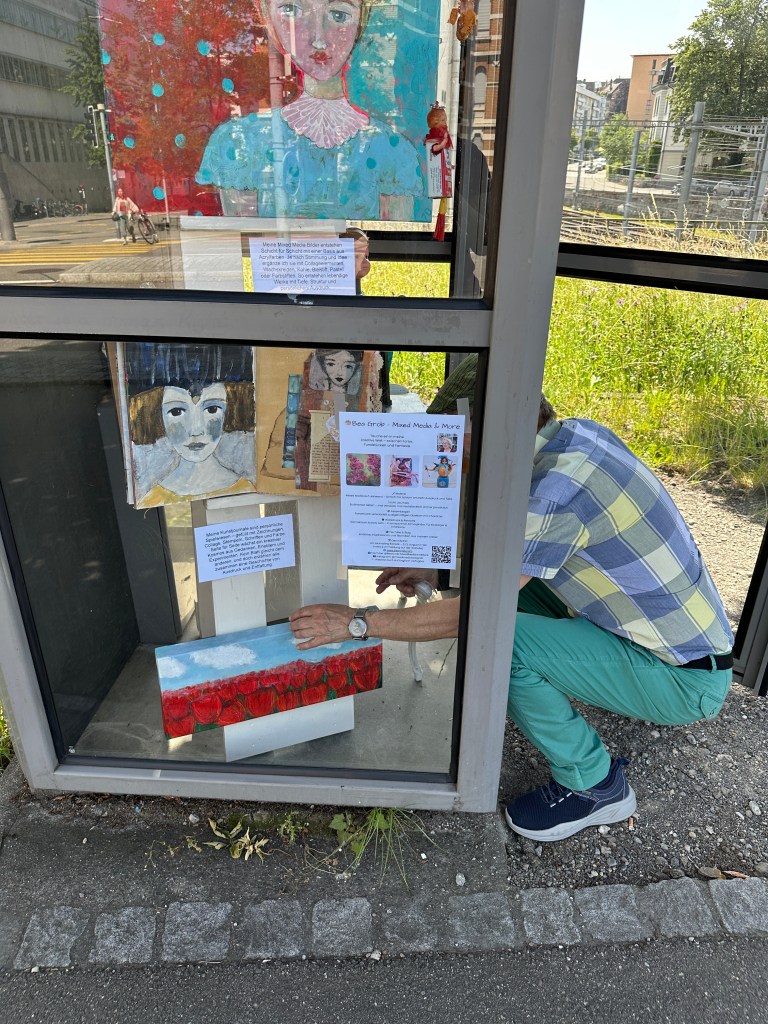 Final adjustments of the poppy field painting and display text