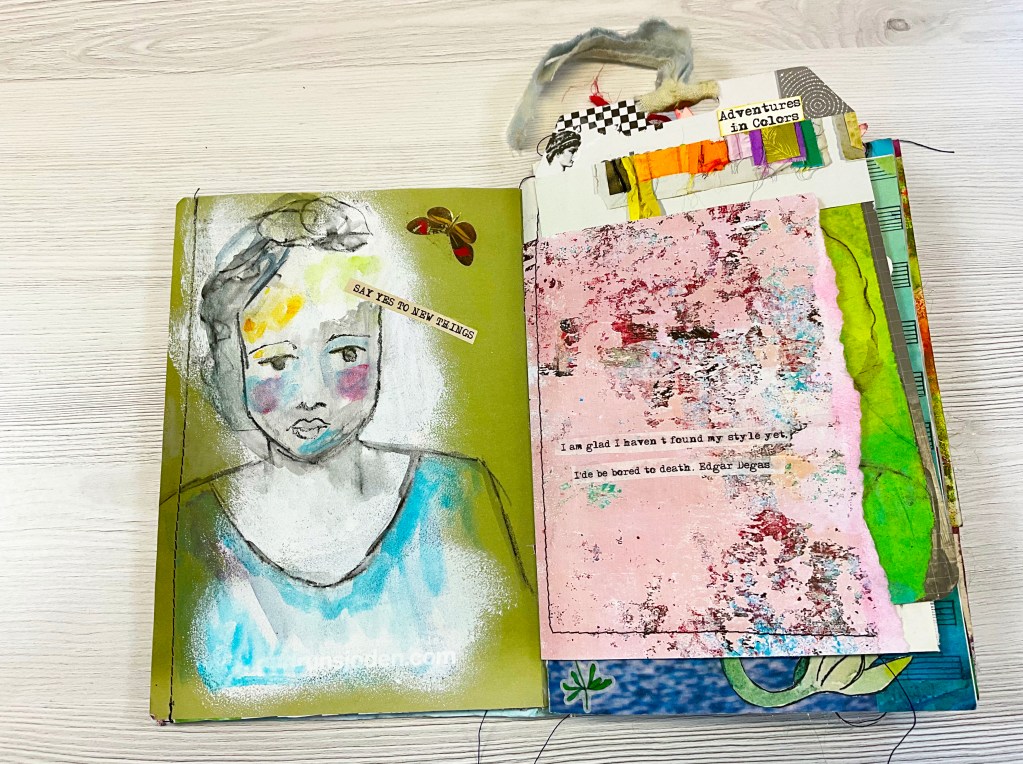 An open journal page featuring a hand-painted face with expressive features on the left and a colorful, textured page with text on the right, showcasing a creative mixed media design.