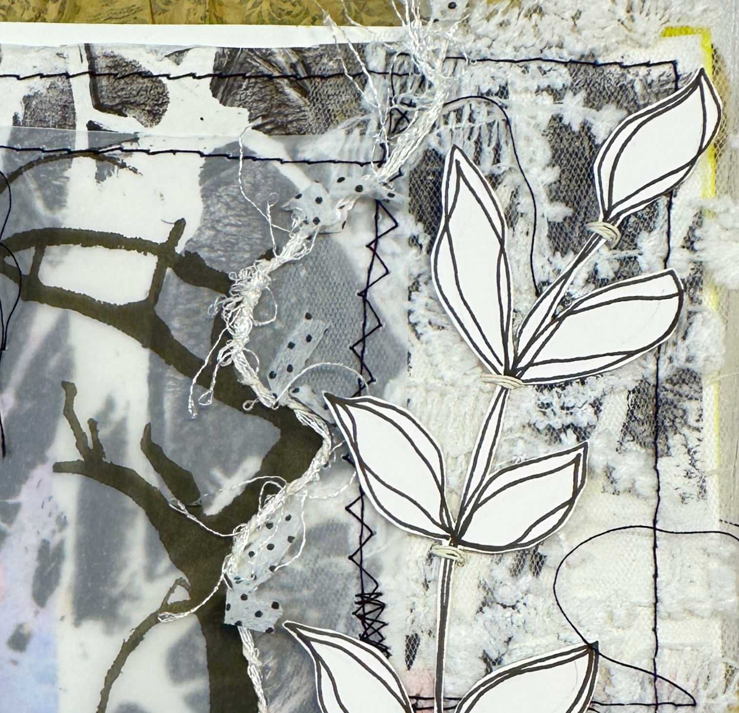 Excerpt from the Page with black and white and some stitching