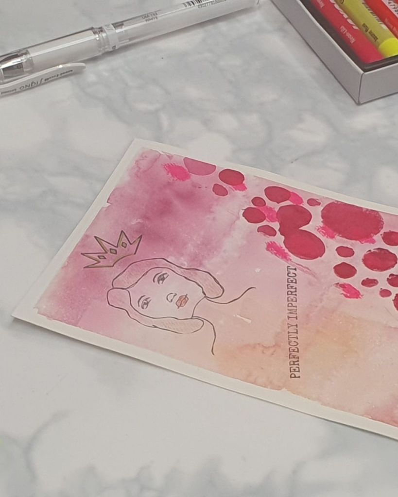 Artistic illustration featuring a female figure with a crown, overlaid with watercolor textures in shades of pink and orange, accompanied by the words 'PERFECTLY IMPERFECT.'