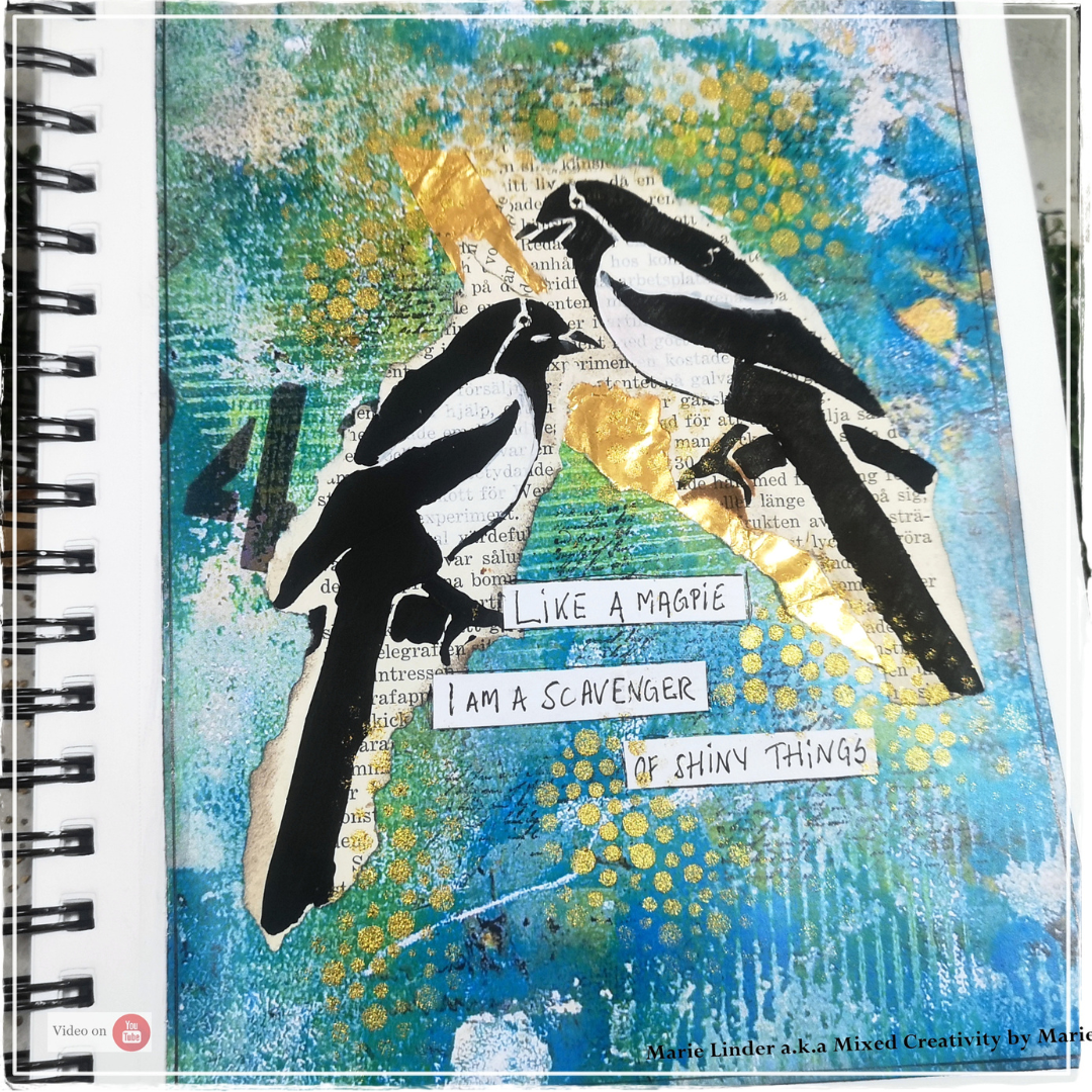 A mixed media artwork featuring two stylized magpie birds on a colorful textured background with gold leaf accents and text reading 'Like a magpie I am a scavenger of shiny things.e